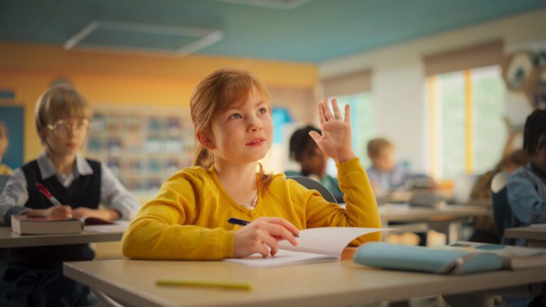 student raising hand approved